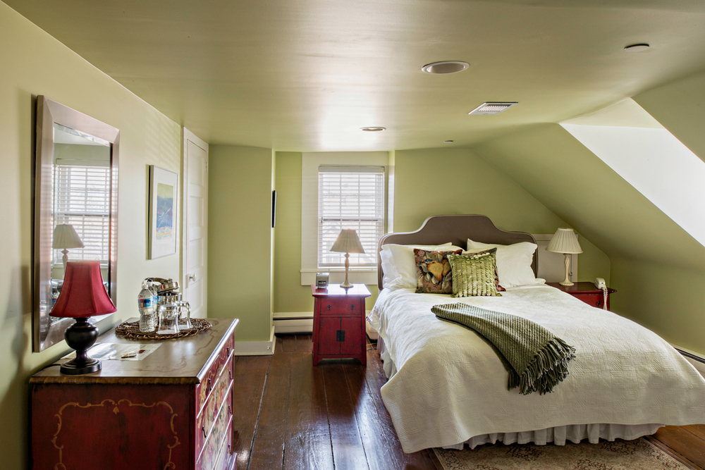 SECKEL PEAR ROOM Deep dormer windows invite the beauty of natural light to add to the getaway feeling in this three-room queen suite.  The Seckel room at the top of the Inn is one of our biggest suites with a cozy sitting room for spreading out or for making a longer stay feel more like home.  The Seckel has a queen bed, complementary breakfast, television, wi-fi, and private bath with shower.