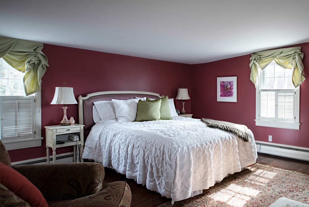 COMICE PEAR ROOM   Overlooking our garden and toward the back of the house, the Comice room is our most quiet.  Spacious enough for a cozy club chair, dressing table and café table the room is a peaceful retreat.  The Comice features a cozy queen bed, complementary breakfast, television, wi-fi, and private bath with small shower and narrow bathroom.  Enjoy quiet time and garden views from this crimson room!