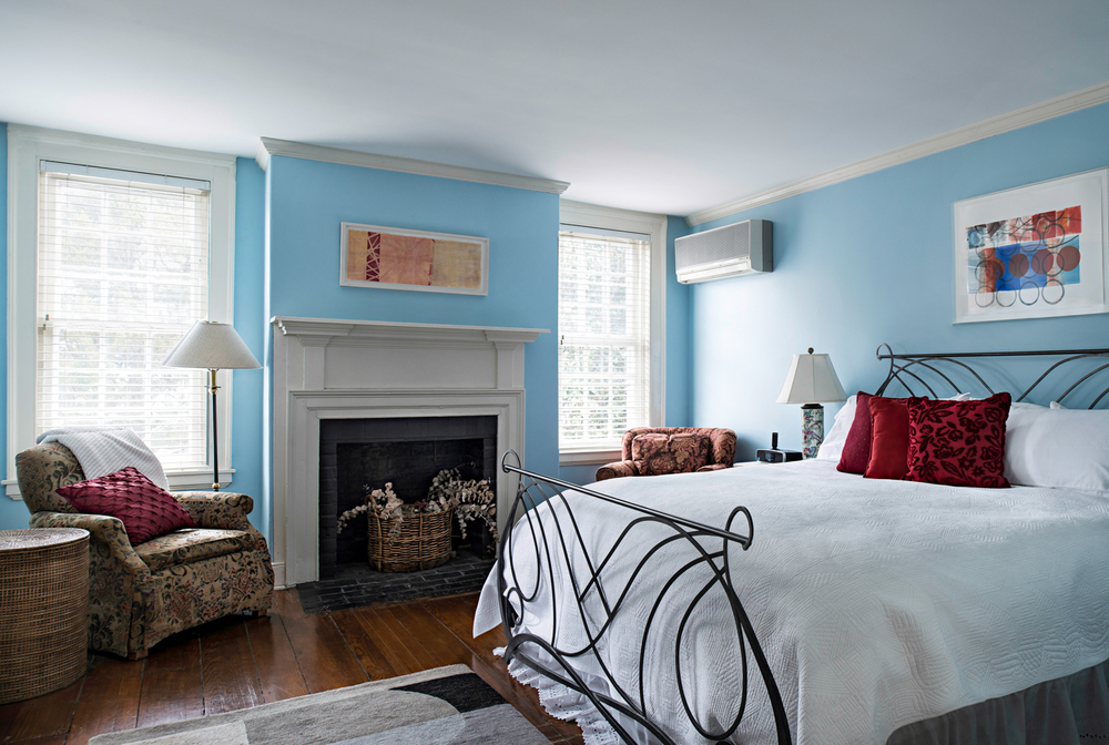 CONCORDE PEAR ROOM This spacious king suite offers a relaxing reprieve from the outside world.  Enjoy an oversized king bed, sitting chairs and a separate dressing room for your belongings.  At the top of the first flight of stairs the room is convenient yet feels like a private oasis.  The Concorde suite has a king bed, complementary breakfast, television, wi-fi, and large private bath with shower and soaking clawfoot tub.